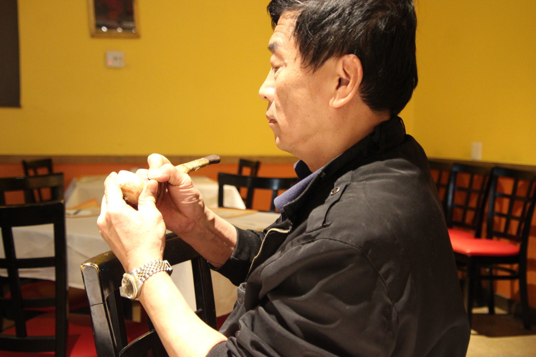 Head Chef and co-owner Sunny Hsu carving radishes into flowers (a trick he learned from his parents back in Taiwan) .JPG